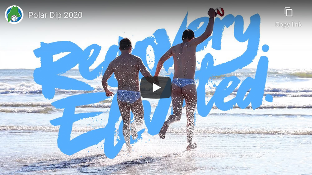 Two men run into January Atlantic Ocean in speedos for Foundation House. This is the cover of the Polar Dip 2020 video.